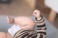 Tiny baby hand and leg close up still on an indoor home scene Royalty Free Stock Photo