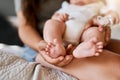 Tiny baby toes are the cutest thing in the world. a mother holding her babys feet.