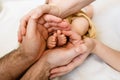 Tiny baby feet toes in parents hands Royalty Free Stock Photo