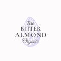 Tiny Bitter Almond Abstract Vector Sign, Symbol or Logo Template. Elegant Almond Nut Sillhouette with Retro Typography