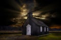 The tiny black church called the BÃÂºÃÂ°akirkja sits alone among a field of lava rock - Iceland