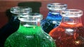 tiny bottles containing colored liquids. Chemistry experiment Royalty Free Stock Photo