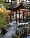 Tiny bridge and small oriental style gazebo at traditional Chinese garden Royalty Free Stock Photo