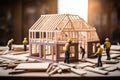 Tiny builders at work: miniature construction workers skillfully assemble an architectural model