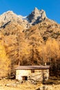 Tiny chalet in the italian Alps with a colourful panorama Royalty Free Stock Photo