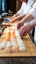 Tiny characters in red berets create sushi rolls using bamboo sticks on a wooden table, capturing intricate details in a