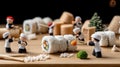 Tiny characters in red berets create sushi rolls using bamboo sticks on a wooden table, capturing intricate details in a