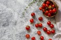 Tiny cherry tomatoes ciliegini, pachino, cocktail. group of cherry tomatoes on a gray concrete background. ripe and juicy cherry Royalty Free Stock Photo