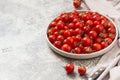 Tiny cherry tomatoes ciliegini, pachino, cocktail. group of cherry tomatoes on a gray concrete background. ripe and juicy cherry Royalty Free Stock Photo