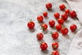 Tiny cherry tomatoes ciliegini, pachino, cocktail. group of cherry tomatoes on a gray concrete background. ripe and juicy cherry Royalty Free Stock Photo