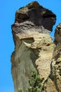 Tiny climbers on overhanging cliff