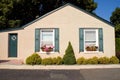 Tiny cottage with flower boxes