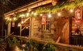 Tiny and Cozy house Cabin Exterior with Christmas lights. Ideal picture that brings up holiday spirit Royalty Free Stock Photo