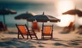 Tiny deck chairs and umbrellas on the beach