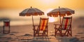 Tiny deck chairs and umbrellas on the beach