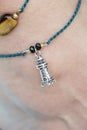 Tiny jewelry in the shape of lighthouse