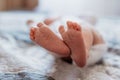 tiny foot of newborn baby in soft selective focus Royalty Free Stock Photo