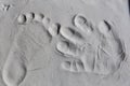 Tiny footprint and handprint texture on grey clay