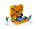 Tiny Girls Take Out Traveling Clothes or Accessories from Huge Suitcase after Vacation Trip, Summer Time Leisure Journey