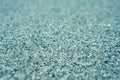 Tiny gravel texture on blue light concrete wall. Texture background seamless gravel floor Royalty Free Stock Photo