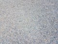 Tiny grey and blue pebbles or gravel on the ground