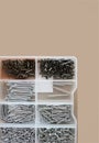 Tiny Hardware Sorted In Compartments, Neatly Arranged Tiny Screws And Washers In Transparent Case Royalty Free Stock Photo