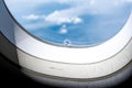 Tiny hole or bleed hole in airplane window compensate for difference between the pressure inside the cabin of a plane and that out Royalty Free Stock Photo