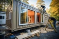 Tiny Home Magic: Construction of a Stylish Container House from Shipping Container. Royalty Free Stock Photo