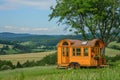 A tiny home on wheels in a picturesque landscape