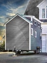 Tiny gray mobile house in driveway Royalty Free Stock Photo