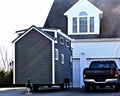 Tiny House Big Garage Royalty Free Stock Photo