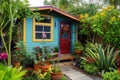 tiny house in lush, colorful garden setting