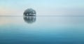 Tiny island covered by forest on the lake Royalty Free Stock Photo