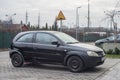 Small black German car Opel Astra parked