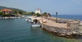 The Tiny Mermaid Madonna Church sits right by the harbour at Skala Sikaminias L