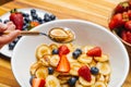 Tiny pancakes for breakfast. Pancakes with strawberries and blueberries cooked in the morning for breakfast in the home kitchen. Royalty Free Stock Photo