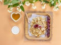 Tiny  pancakes cereal, cherries, milk and honey. Decorated with sprigs of Jasmine. Trendy  food, home breakfast. Funny food for Royalty Free Stock Photo