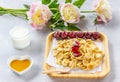 Tiny  pancakes cereal, cherries, peonies, milk and honey on a light background. Trendy  food, home breakfast. Funny food for kids Royalty Free Stock Photo