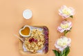 Tiny  pancakes cereal, cherries, peonies, milk and honey. Trendy  food, home breakfast. Funny food for kids. Top view, flat lay Royalty Free Stock Photo