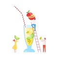 Tiny People Making Cocktail, Young Man and Woman Putting Fruits to Big Glass with Juice Using Ladder, Cold Sweet Summer Royalty Free Stock Photo