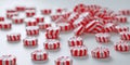 Tiny peppermints in red and white stripes on white Royalty Free Stock Photo