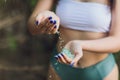 Tiny pieces of plastic collected from sandy beach in hands of environmentalist. Microplastic is polluting the sea and Royalty Free Stock Photo