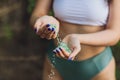 Tiny pieces of plastic collected from sandy beach in hands of environmentalist. Microplastic is polluting the sea and Royalty Free Stock Photo