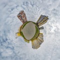 tiny planet in blue sky with clouds in city center near modern skyscrapers. Transformation of spherical 360 panorama in abstract Royalty Free Stock Photo