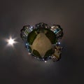 Tiny planet in night in city center near modern skyscrapers or office buildings. Transformation of spherical 360 panorama in Royalty Free Stock Photo