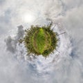 Tiny planet transformation of spherical panorama 360 degrees. Spherical abstract aerial view in Apple orchard. Curvature of space