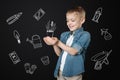 Emotional child feeling impressed while looking at the plant in his hands Royalty Free Stock Photo