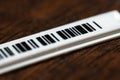 Tiny plastic security anti-theft barcode sticker Royalty Free Stock Photo