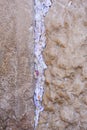 Tiny prayer notes inserted into the cracks and crevices of the Western Wall holy site in Jerusalem, Israel Royalty Free Stock Photo