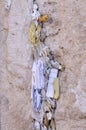 Tiny prayer notes inserted into the cracks and crevices of the Western Wall holy site in Jerusalem, Israel Royalty Free Stock Photo